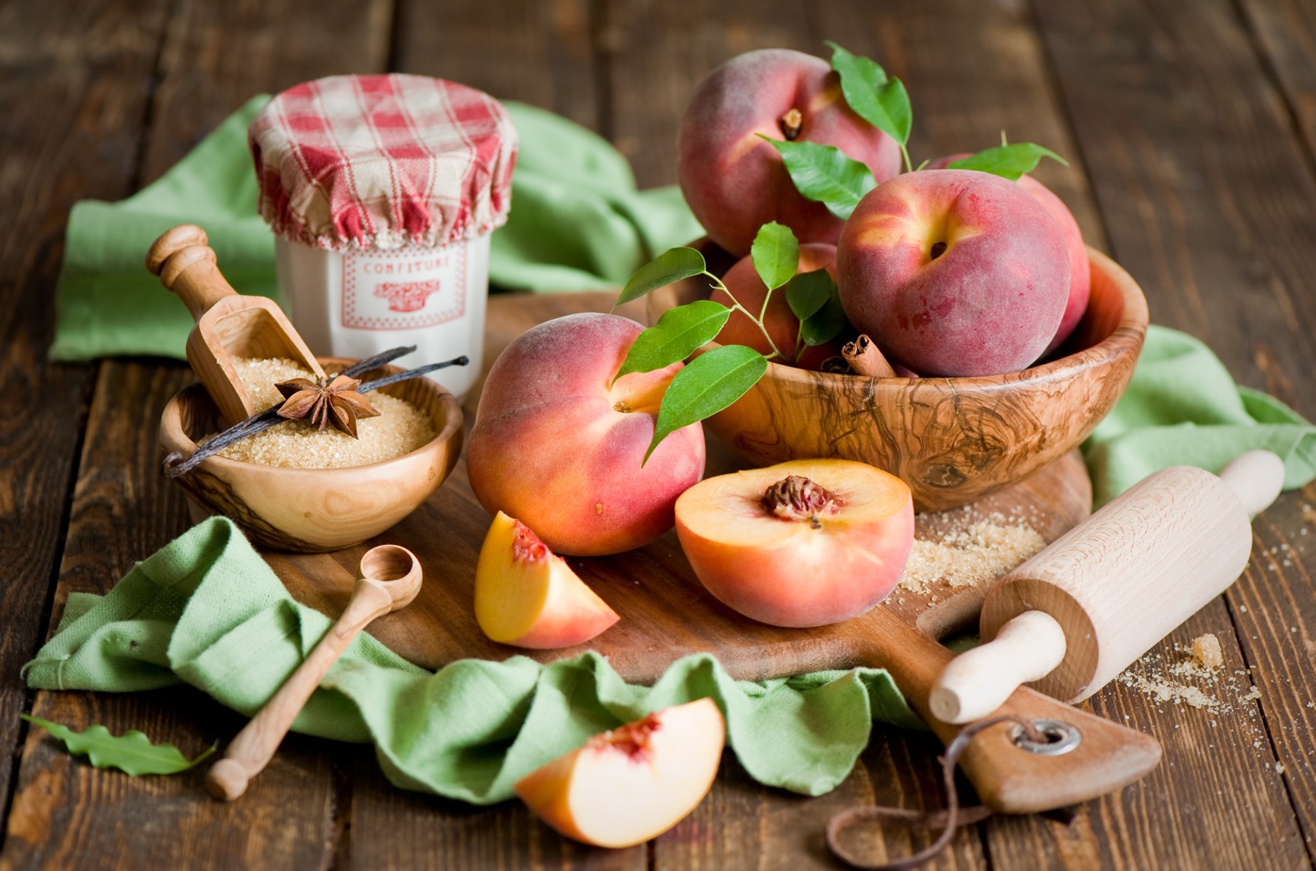 peaches nectarine fruits segments spices vanilla anise star anise cinnamon sugar board rolling pin bowls tableware still life anna verdina