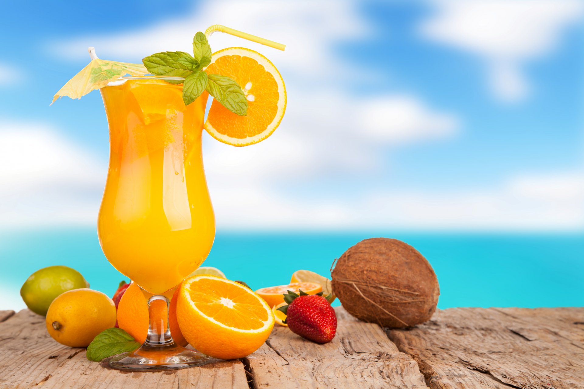 juice orange drink summer glass umbrella straw oranges lime lemon strawberry coconut