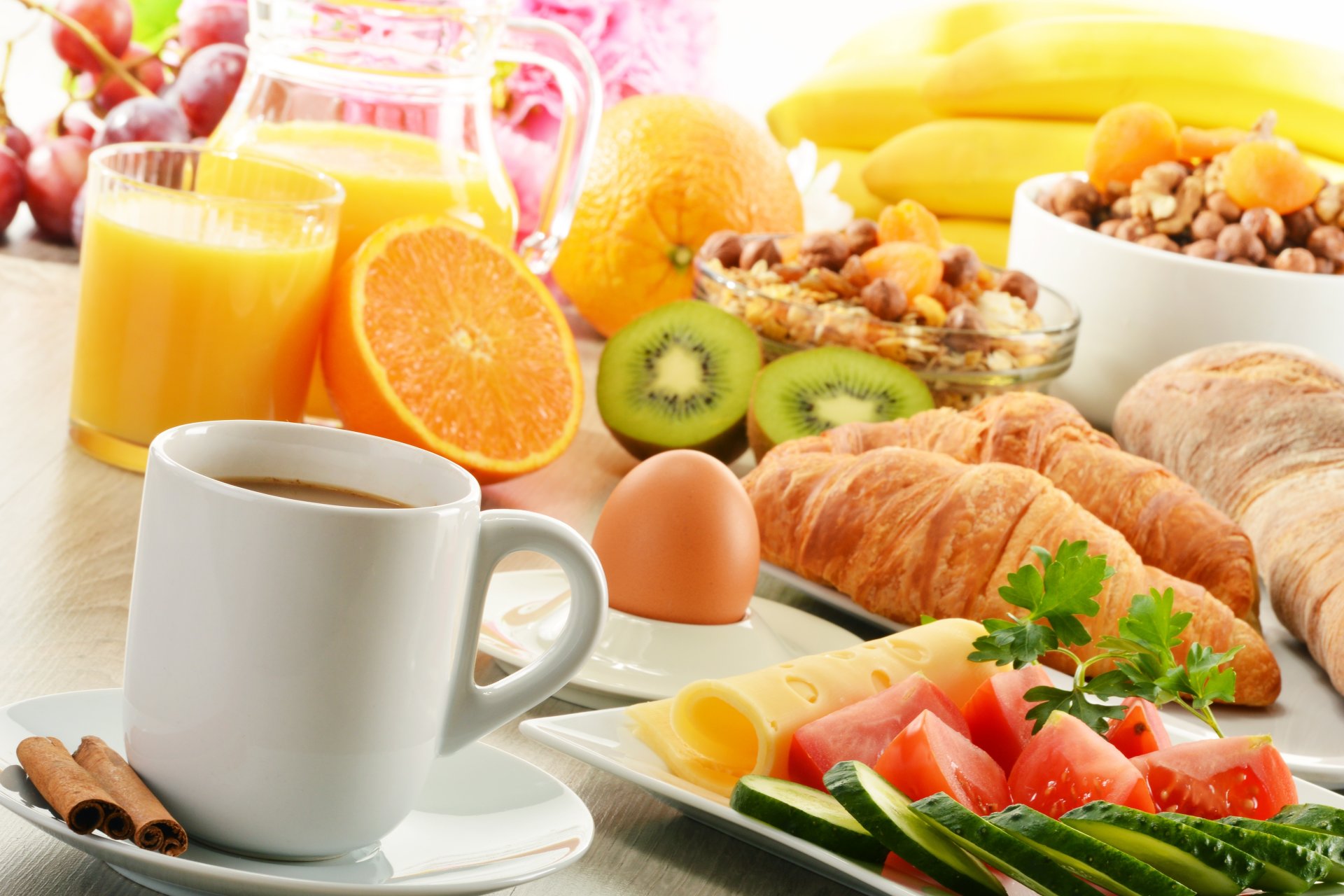 breakfast coffee cinnamon croissants cereals kiwi orange fruits juice cheese tomatoes cucumber vegetables food