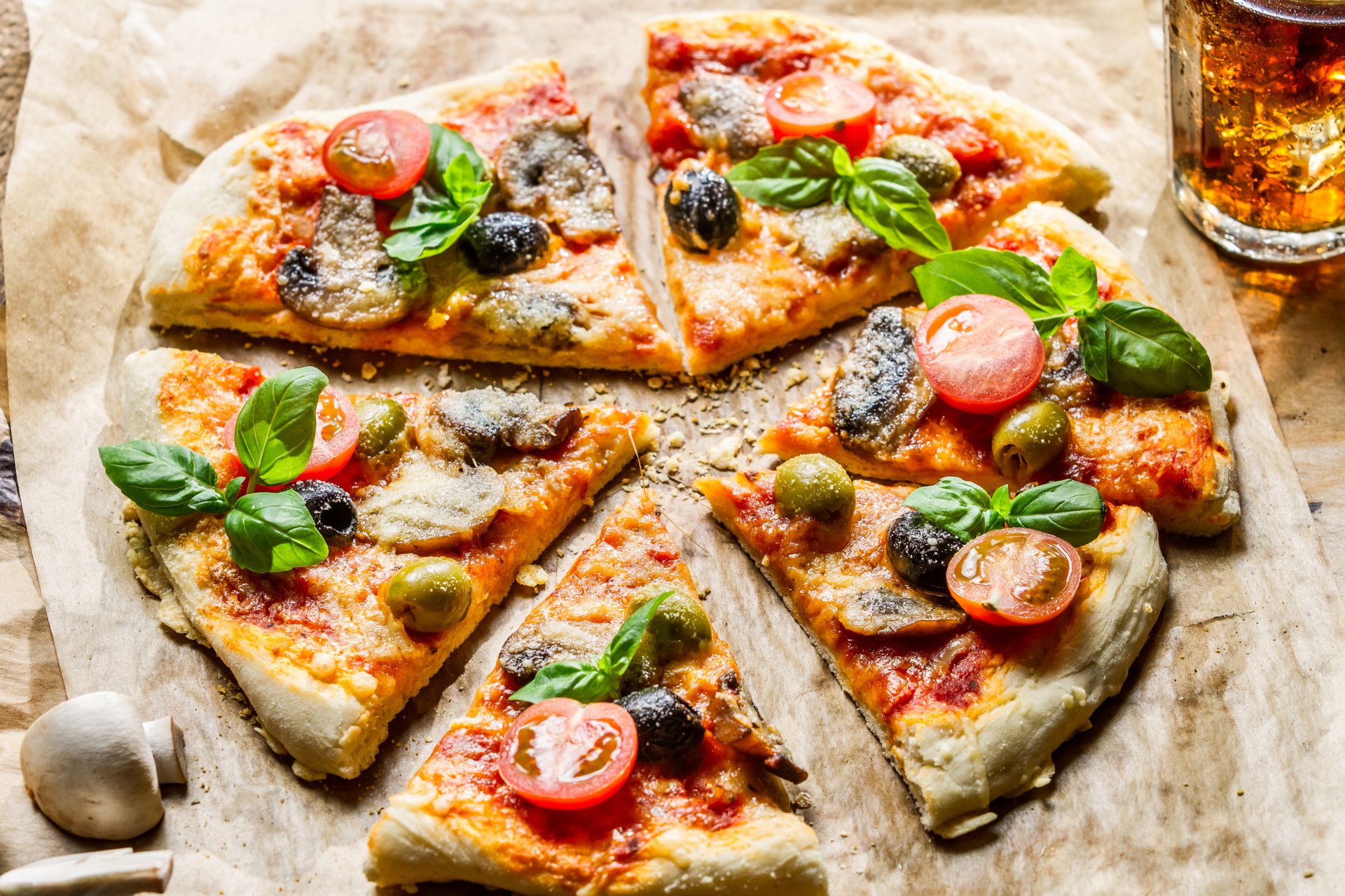 pizza slices slices olives olives tomatoes cheese mushrooms glass drink ice food