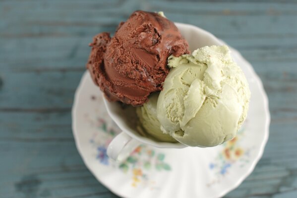 Ice cream balls in a mug on a plate