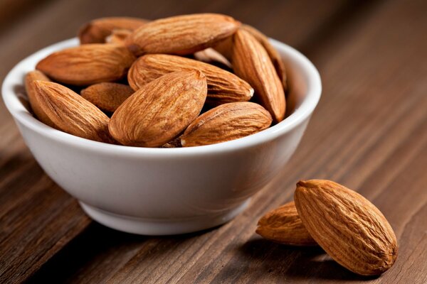 Almonds. nuts. healthy food. plate with almonds