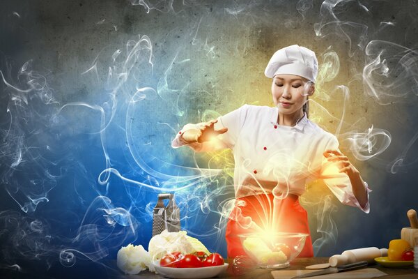 Asian cook conjuring over a dish