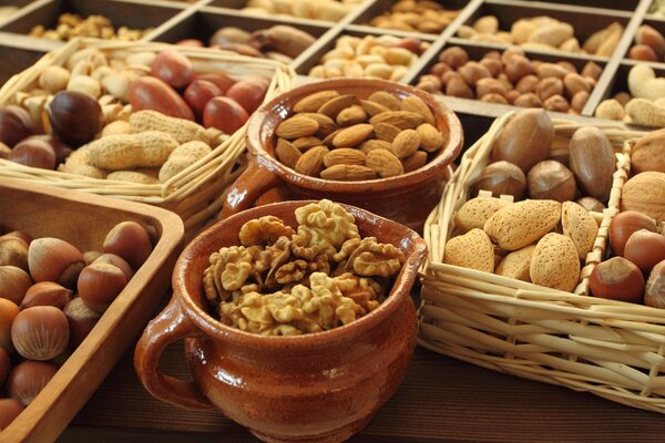 Assorted nuts in a basket and pots