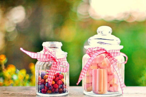 Sweet jars. Multicolored dragees