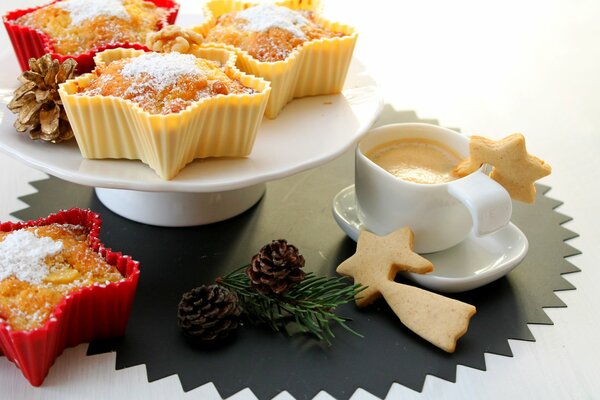 Christmas cookies and cupcakes with coffee