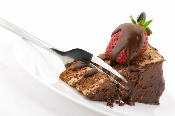 A piece of chocolate cake with strawberries