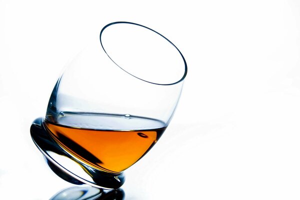 Beautiful cognac glass on a light background