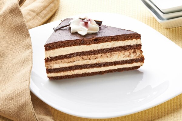 A piece of chocolate cake on a festive plate