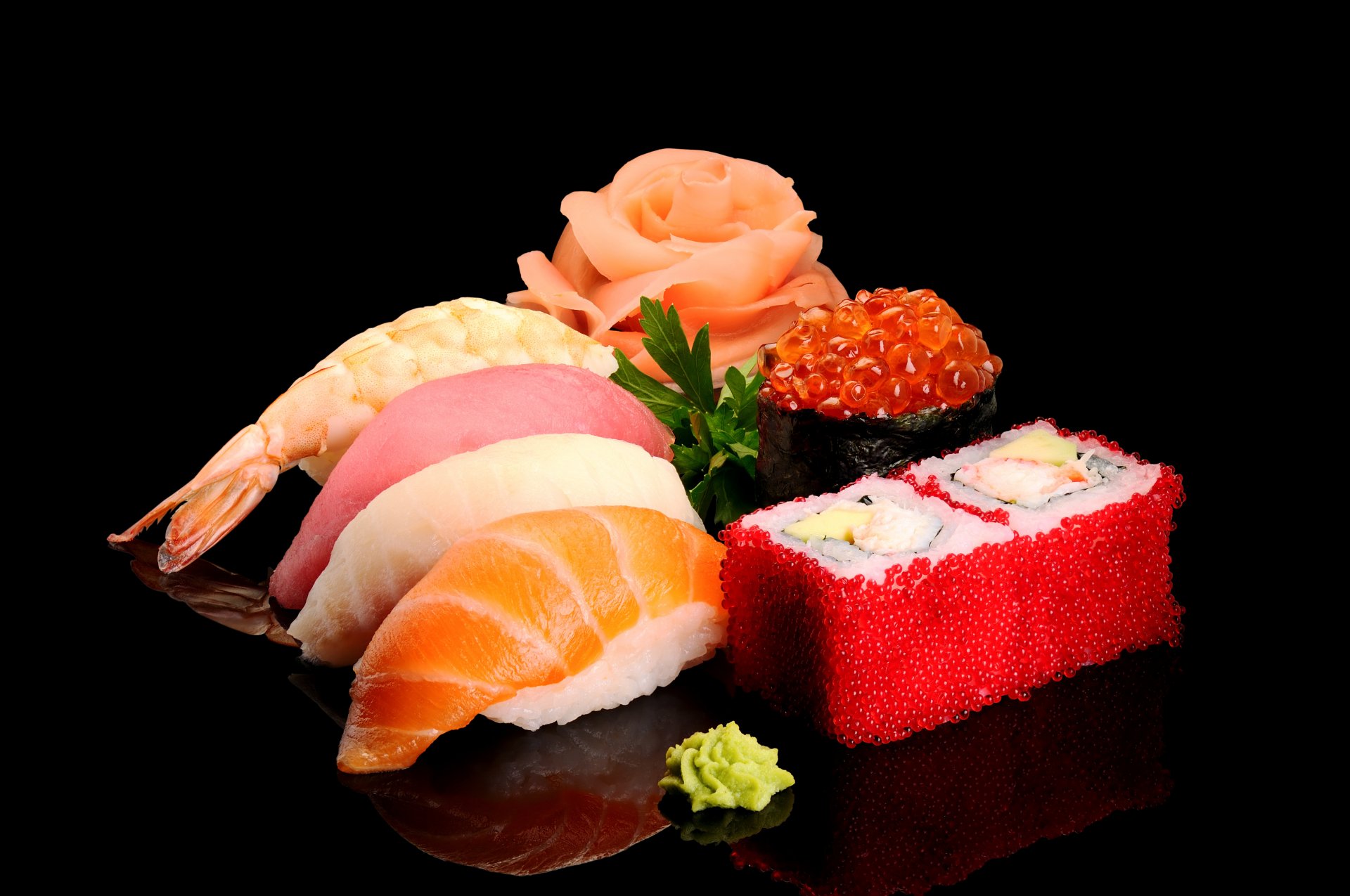 land salmon tuna shrimp fish figure caviar wasabi green seafood black background