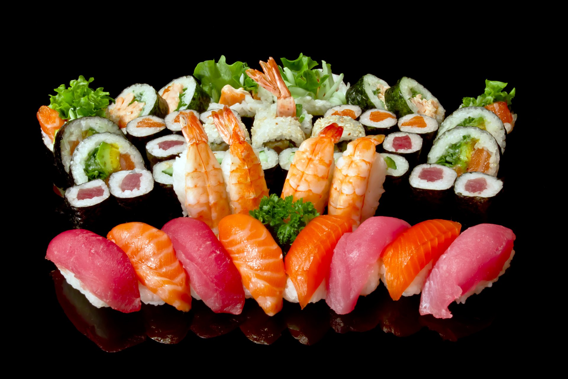 land rolls seafood assorted fish salmon tuna shrimp figure green black background