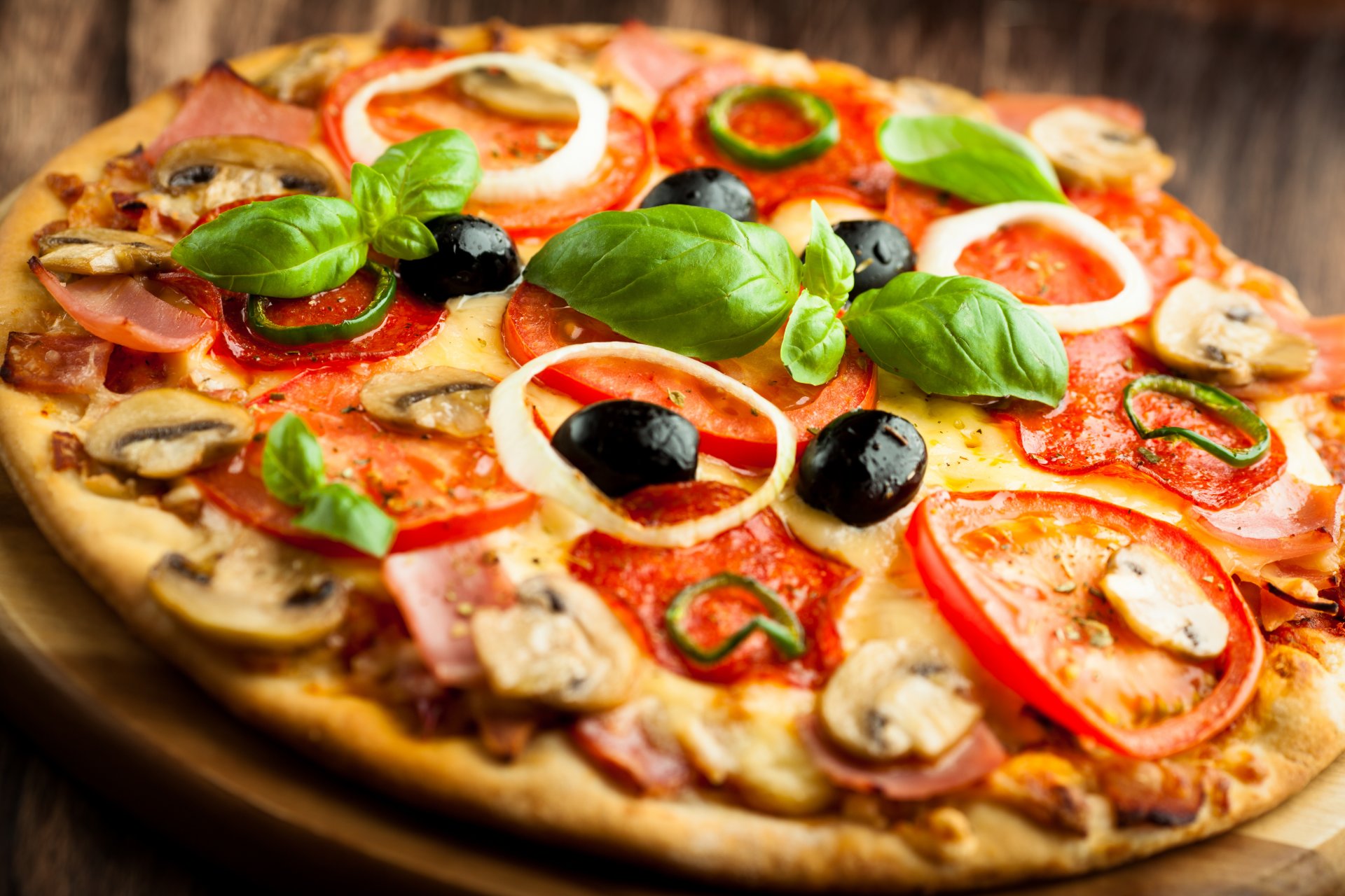 pizza dish olives cheese mushrooms tomatoes ham pepper