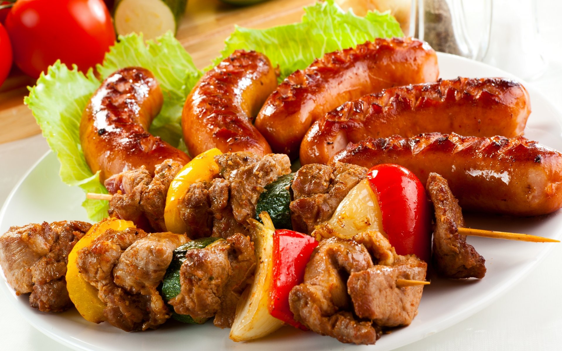 meat sausages fried vegetables greens cabbage tomato cucumber lemon skewers sticks sausage roasted green