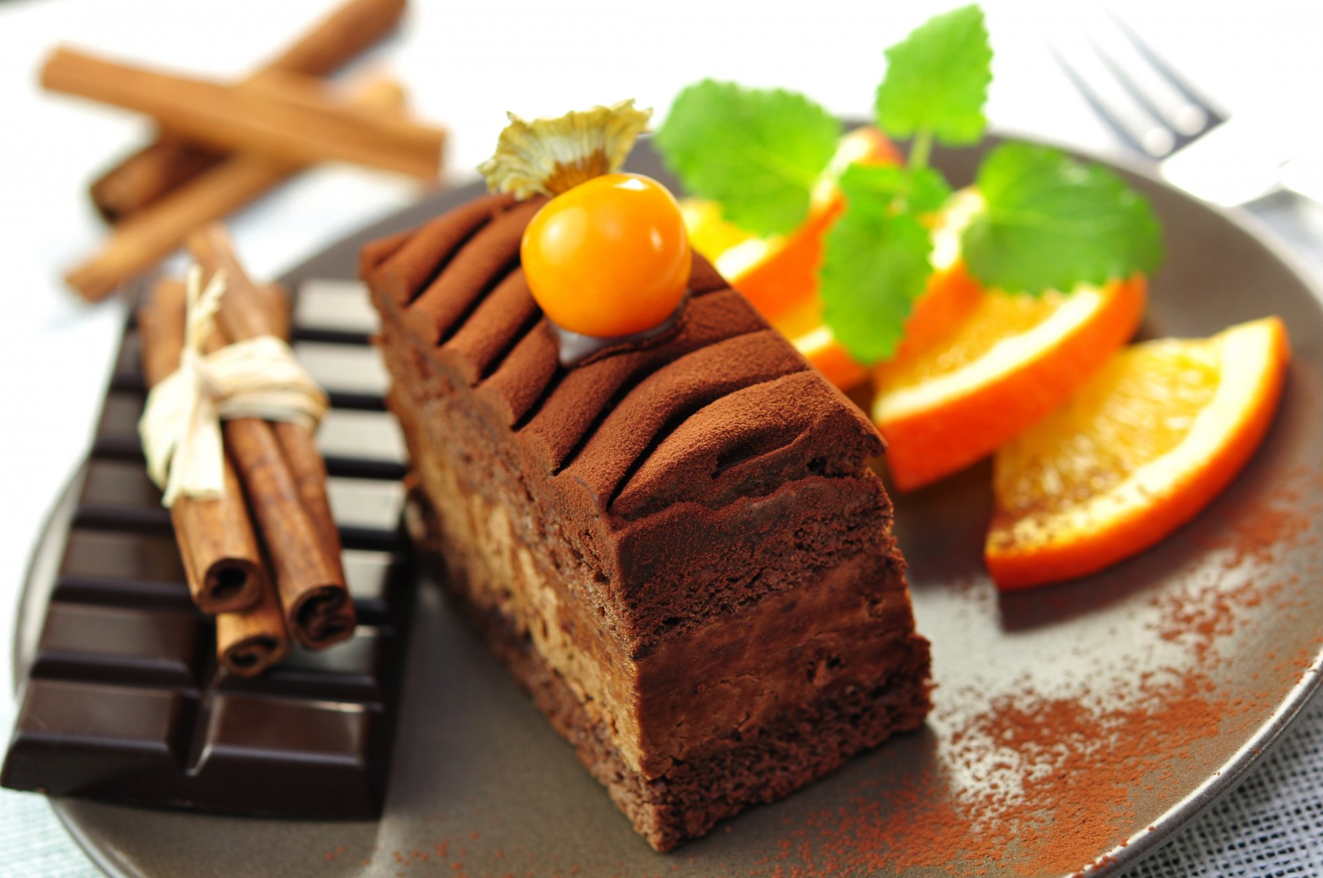 dessert chocolate dark tile cake cake cake slice sticks cinnamon oranges slices fruit food sweet