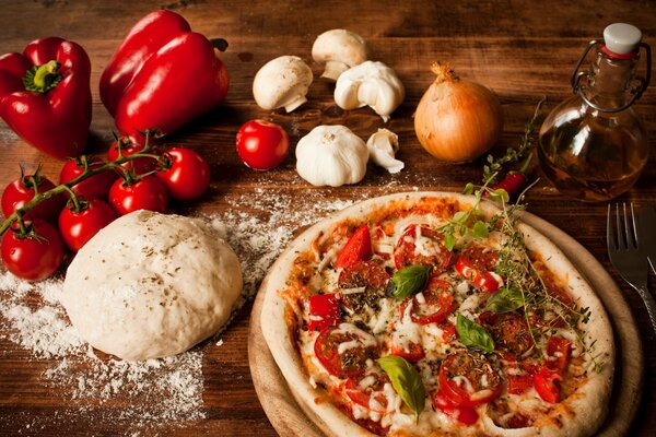 Pizza with tomatoes and bell pepper, pizza dough