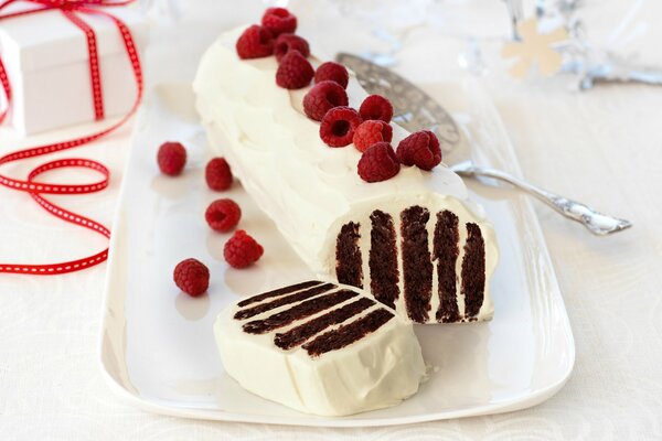 Exquisite sponge dessert with raspberries