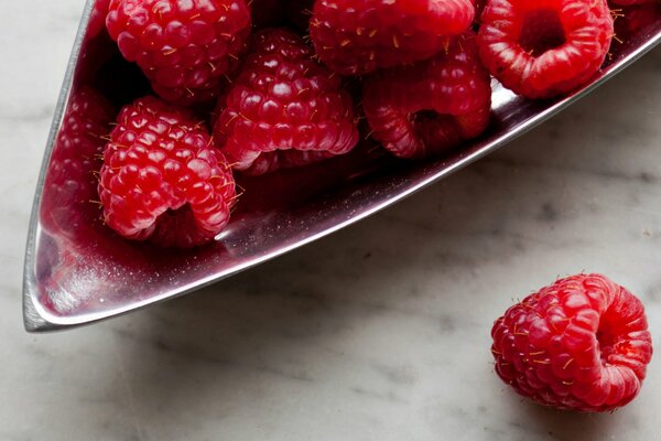 A handful of raspberries in close-up