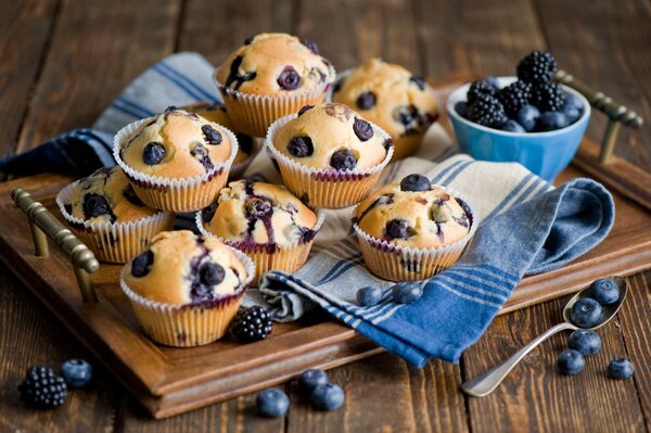 Pastries for dessert with blueberries on a tray