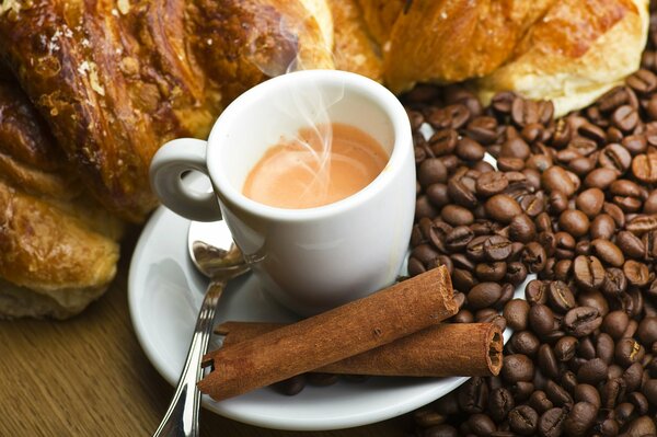 Espresso with cinnamon sticks and coffee beans