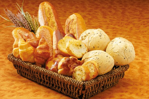 Basket with pastries bread croissants rolls