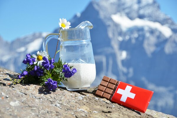 Still life in the Alps chocolate with a jug of milk