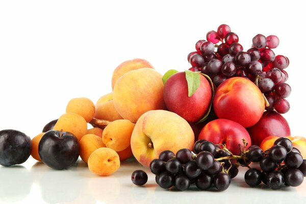 Composition of garden fruits and berries on a white background