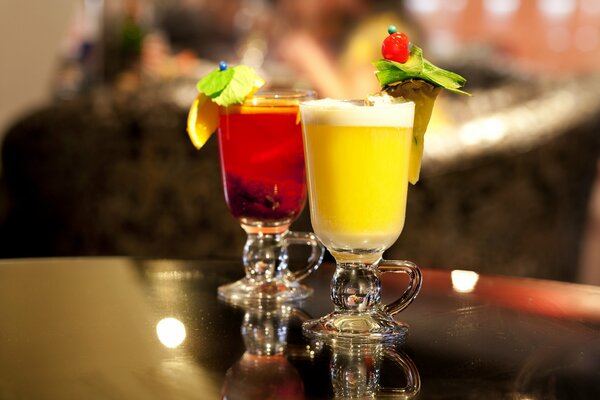 Two cocktails drinks glasses with berries