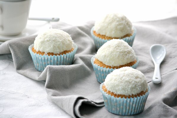 Cupcakes in a blue mold with coconut glaze