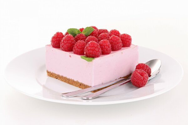 Pink dessert with raspberry and leaf decoration