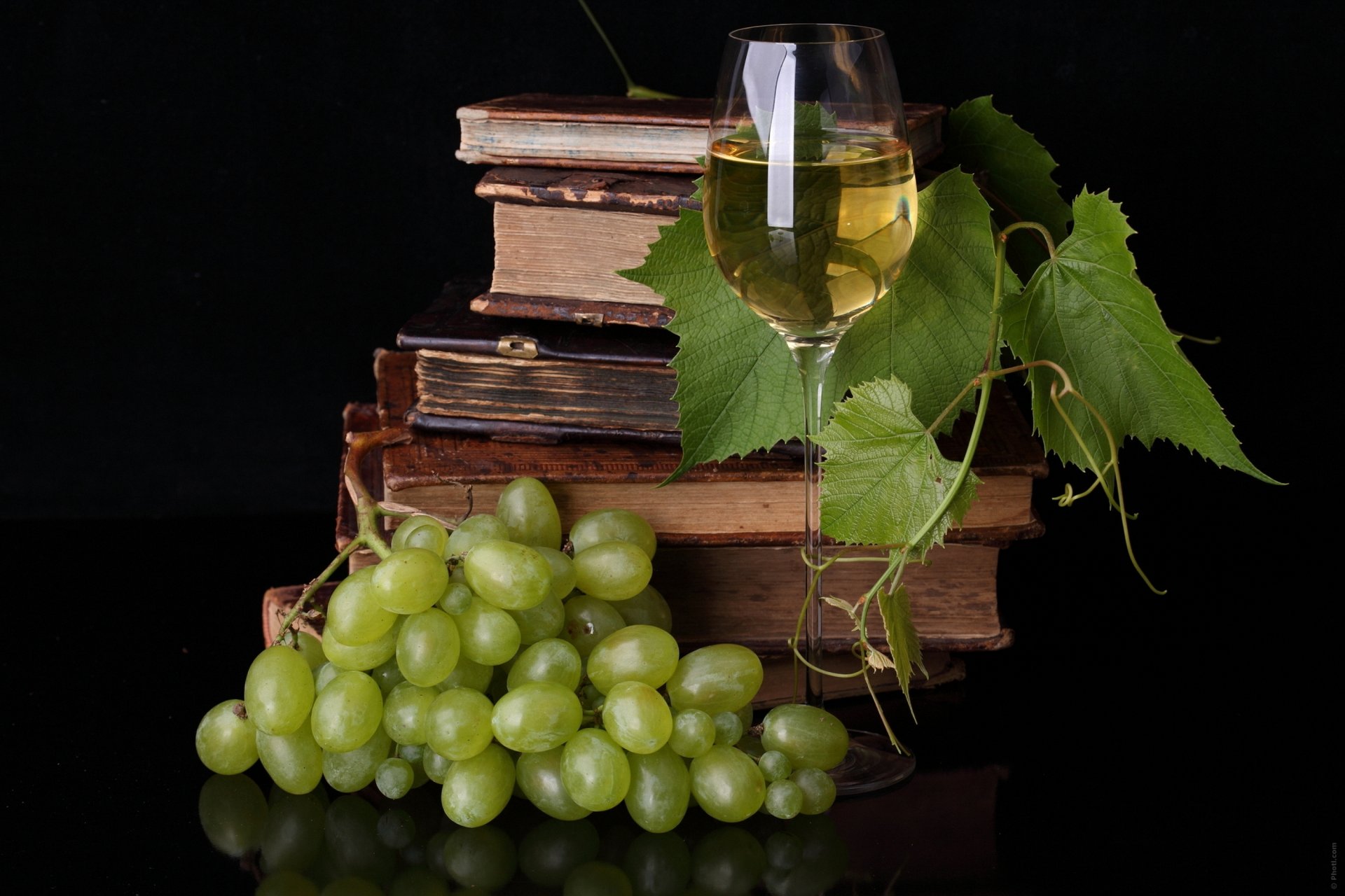 food for thought grapes vine books glass wine table