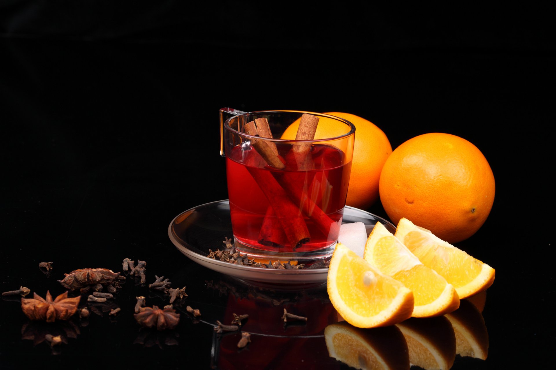 aucer cup tea drink cinnamon table carnation star anise orange slices appetizing