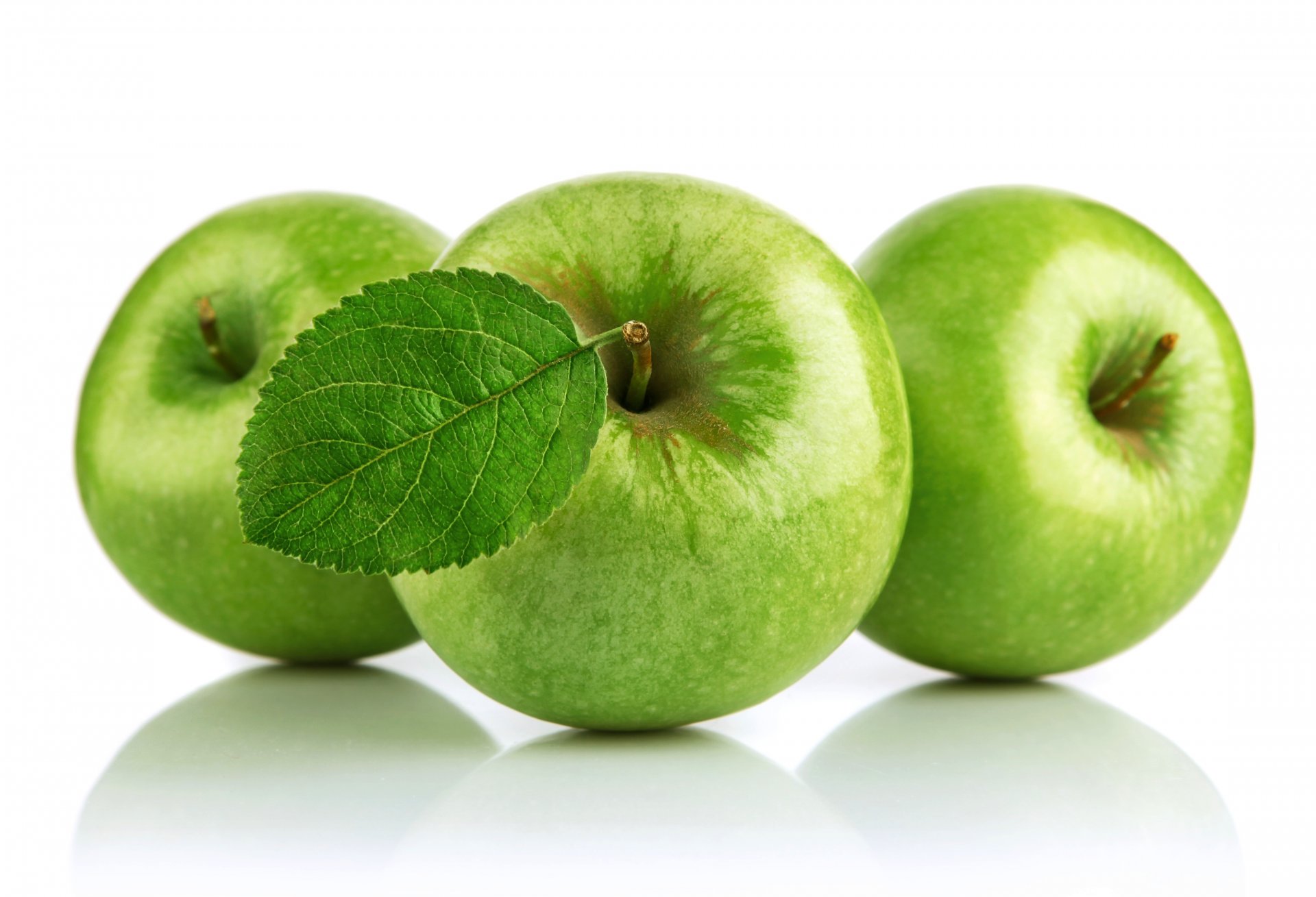 apples green fruits white background