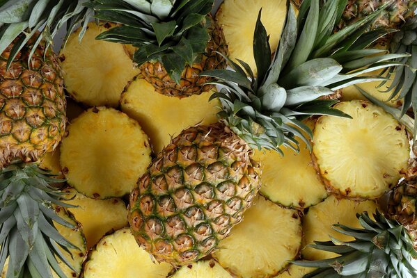 Whole pineapple on the background of pineapple slices