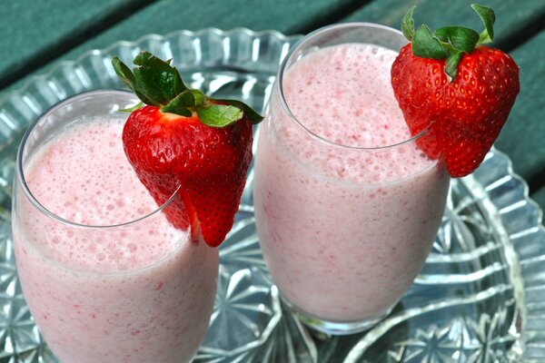 Fresh strawberry cocktail with pieces of berries