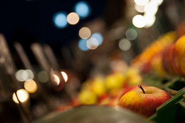 Apples in focus, blurred background with bokeh highlights