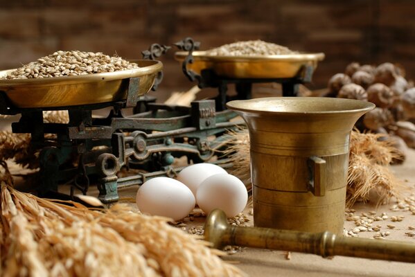 Close-up of grain on scales and eggs