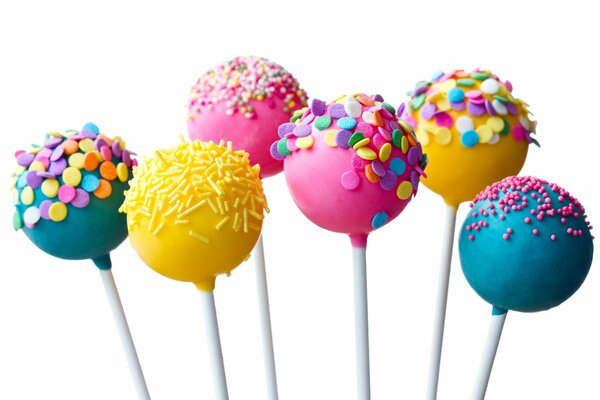 Colorful candies on sticks with different powder
