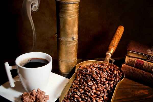 A cup of coffee beans with books