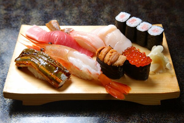 Rolls and sushi with seafood on the board