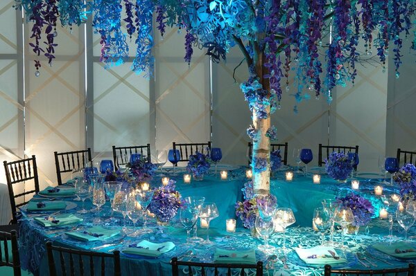 A beautifully laid table with blue flowers