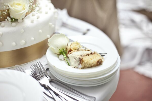 Wedding cake with a flower on a plate