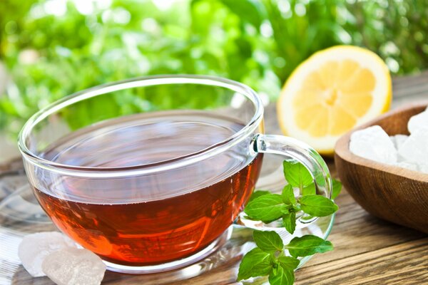 A cup of tea with mint on the table