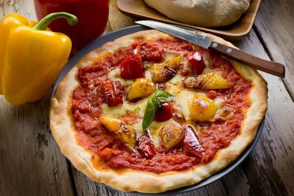 Pizza is a dish of Italian cuisine