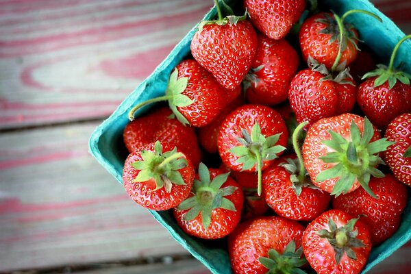 Fresh strawberries in a blue box