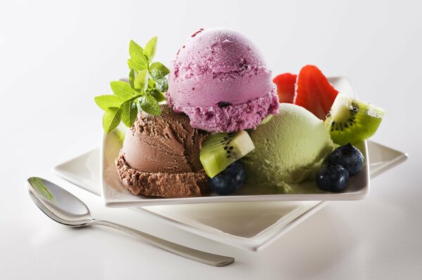 Assorted ice cream decorated with fresh berries and fruits