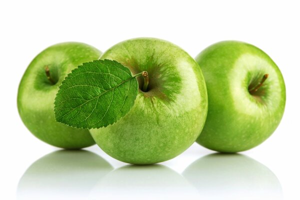 Green apples on a white background