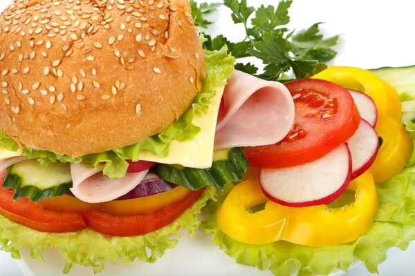 Hamburger with ham and fresh vegetables