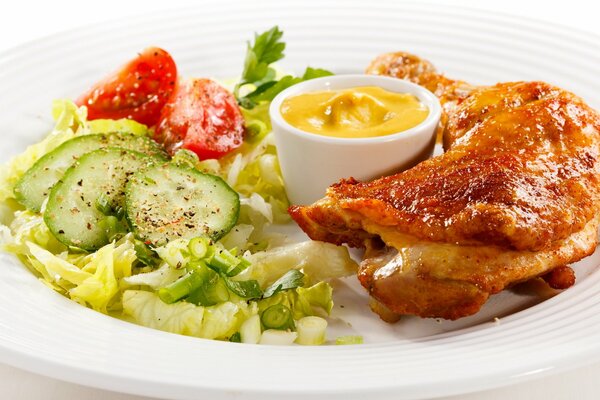 Salad with delicious chicken on a plate