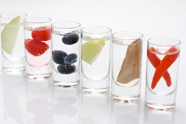 Refreshing drinks with fruits, mushrooms and vegetables in glass glasses