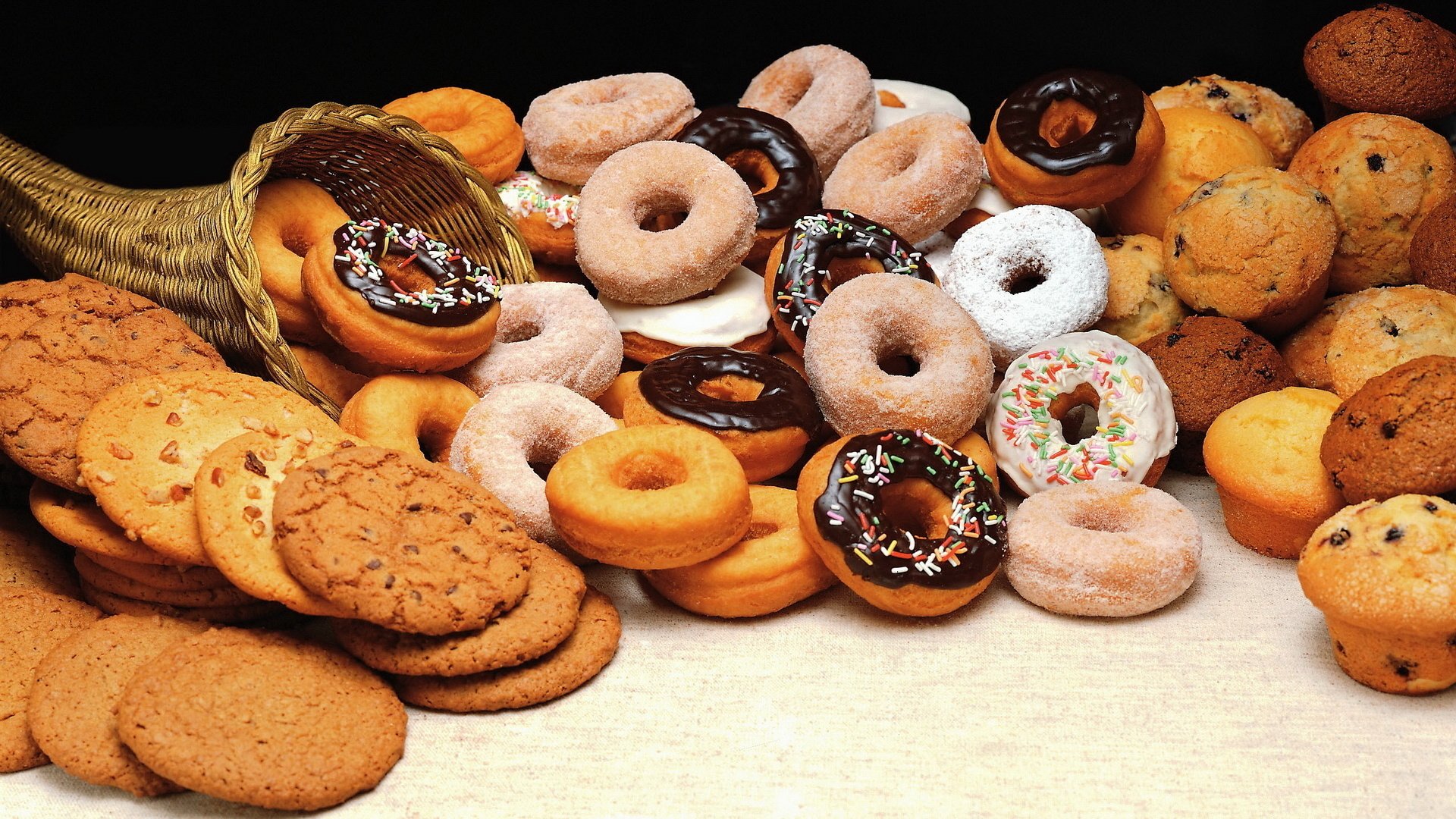 donuts goodies basket many cookies chocolate cupcakes with raisins cream with nothing with sugar powder